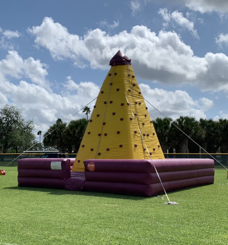Yellow inflatable rock climbing wall