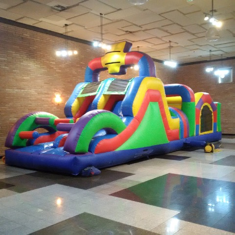 Colorful wacky obstacle course set up in a gym
